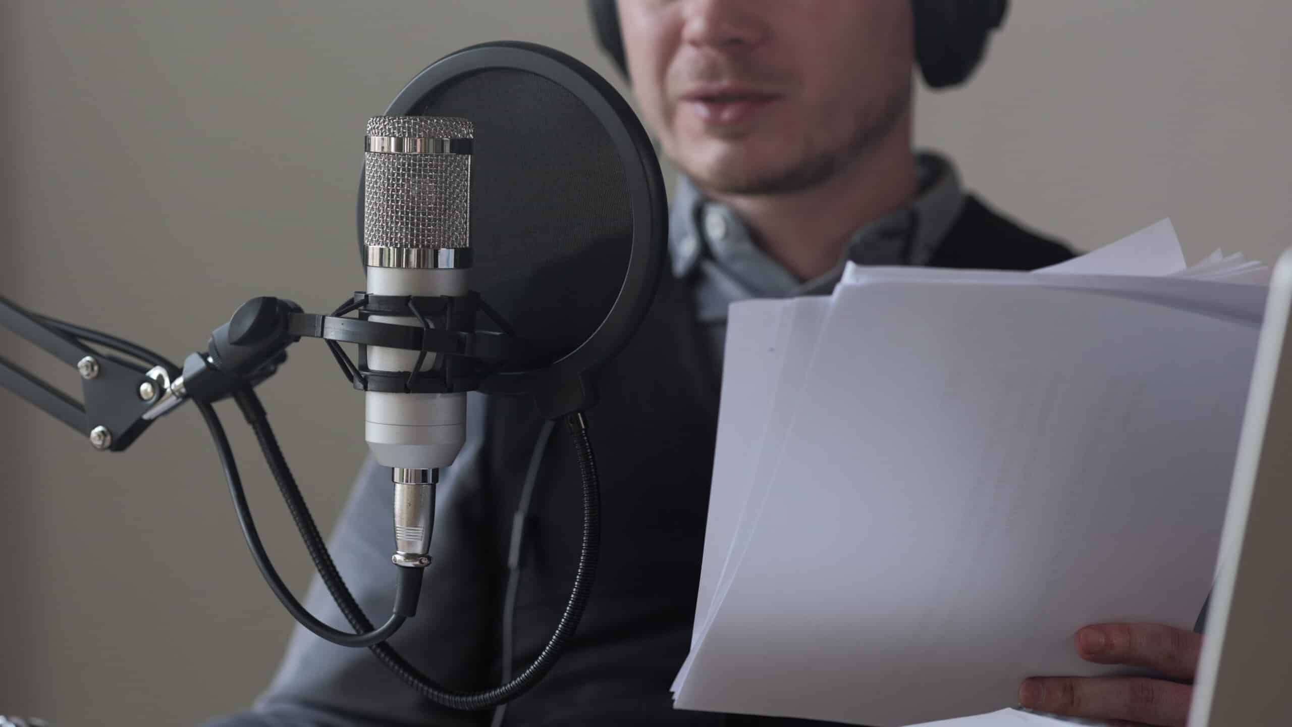 radio host recording podcast close up man read text from paper communicate with audien SBI 351576769